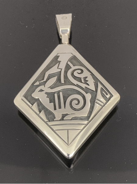 Hopi Sunface and Rabbit Reversible Pendant by Cheryl